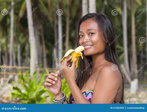 Filipina with a banana .